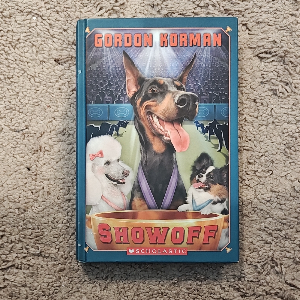 Scholastic 'Showoff' Book with Blue and Red Cover